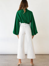 Top con mangas abullonadas y color liso con detalle de lazo